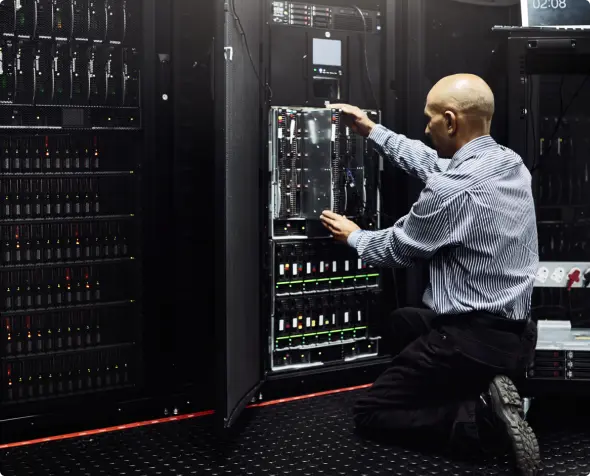 A data center engineer ensuring the durability of the protective layer of the server rack.