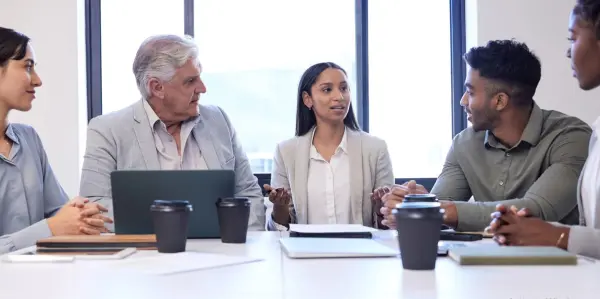 a group of people sitting around a table